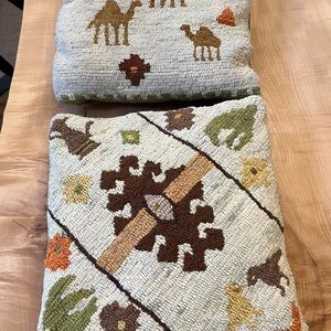 Two hand hooked Middle East themed pillows